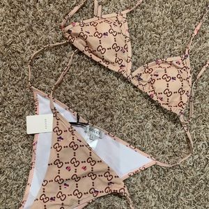 GUCCI bikini set size Large. BNWT on the bottom. Super cute and ready to be worn